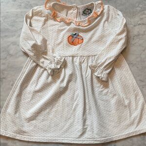 Adorable White Dress with Pumpkin Detail